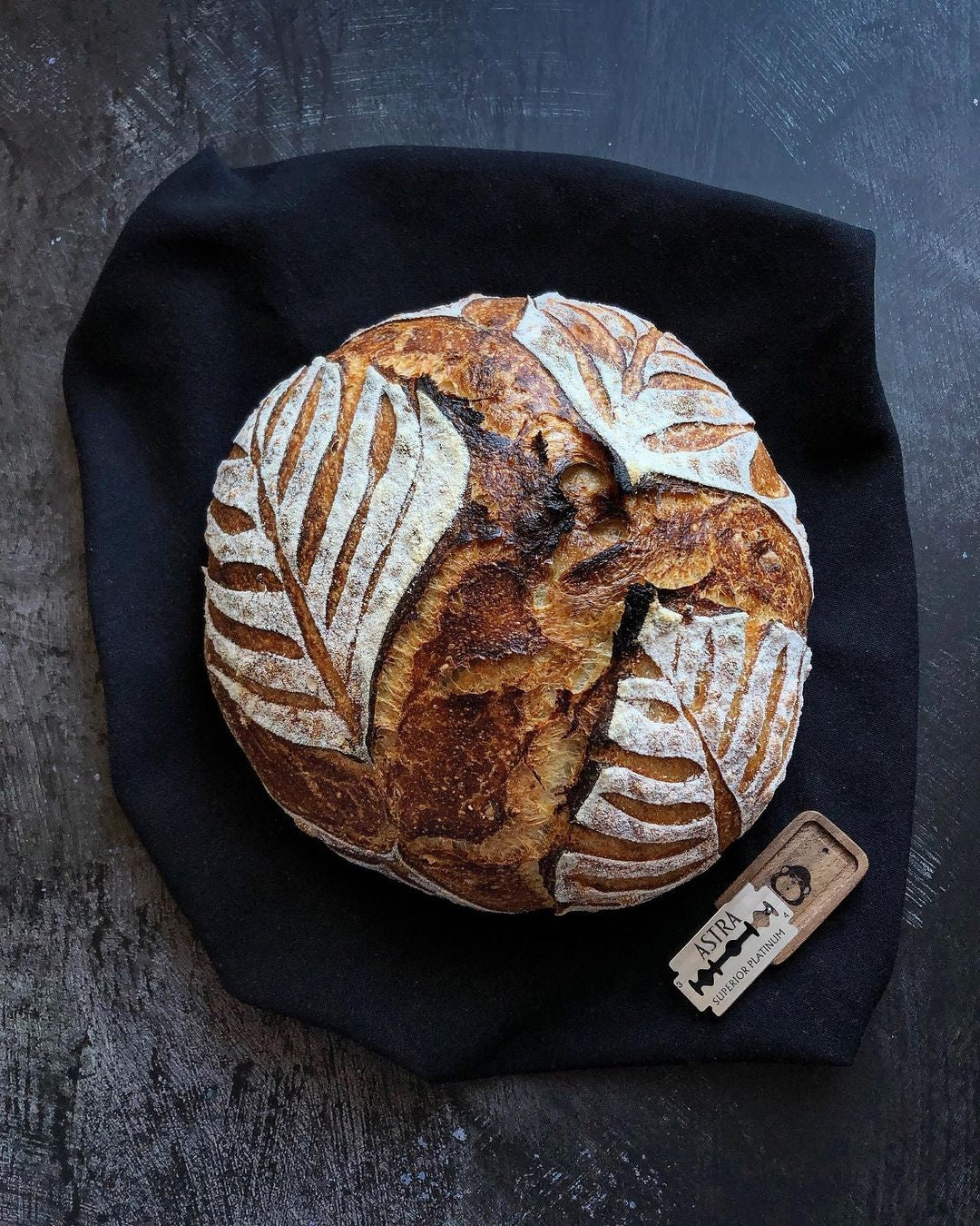 Scored sourdough loaf with a Wire Monkey Poco lame