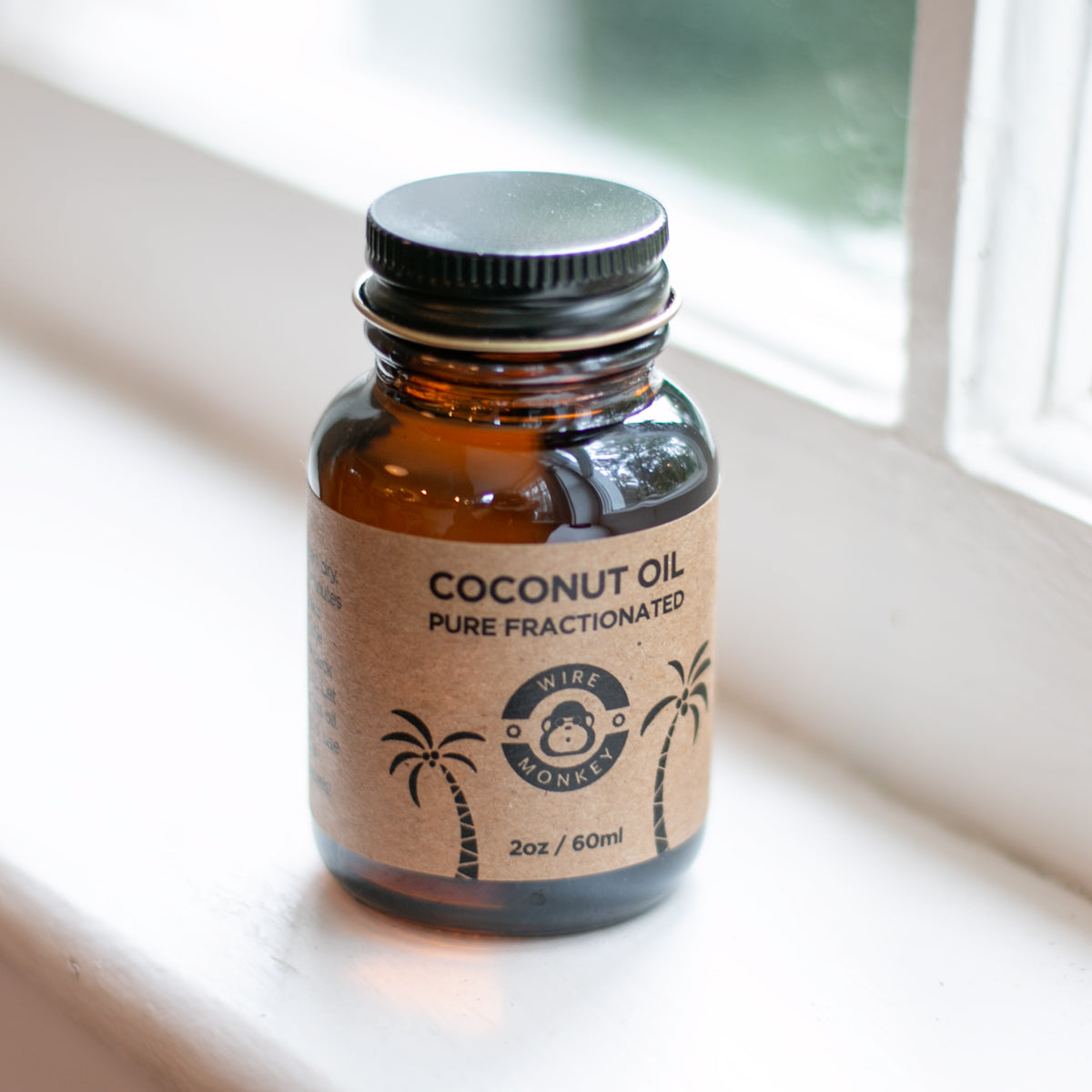 Brown glass bottle of fractionated coconut oil